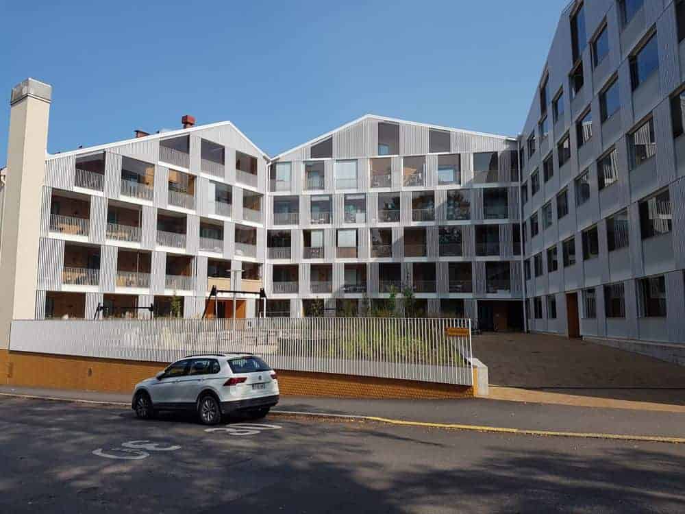 three group of gold coins on top of the newspaper showing statistics on them.